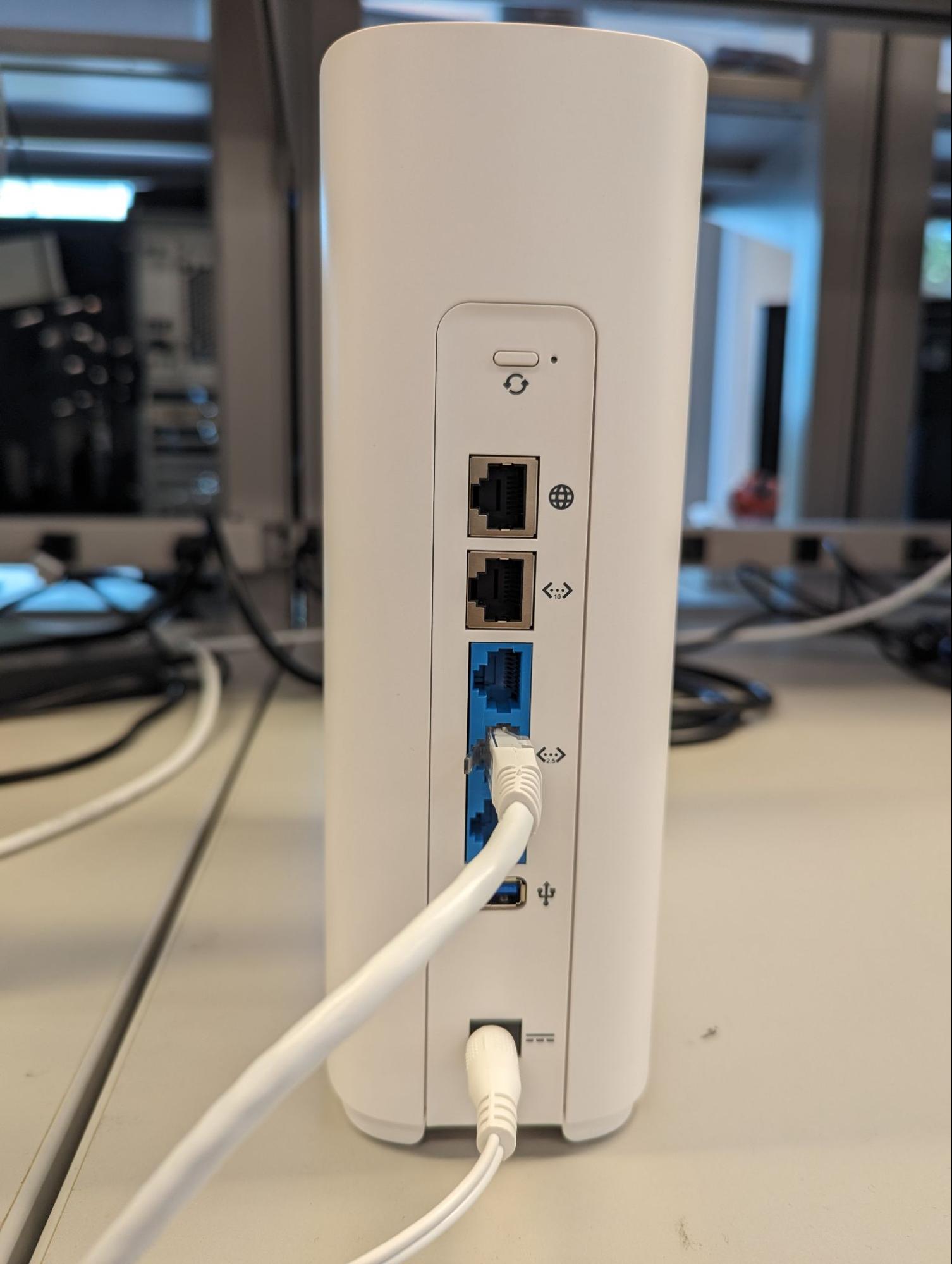 Back of GFiber Wi-Fi 7 mesh extender with Ethernet cable connected
