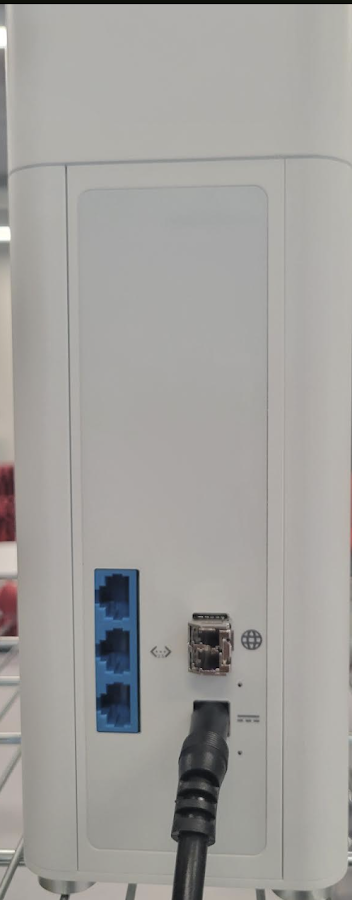 Back of GFiber Wi-Fi 7 router with power cable inserted